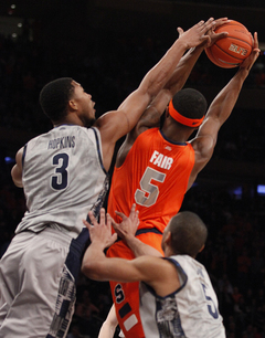 C.J. Fair reaches for a rebound in the paint.