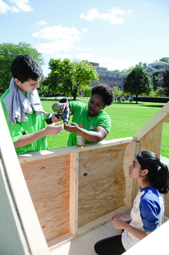 Ray Marek, a sophomore international relations and broadcast journalism major, Carina Rankine, a junior civil engineering major, and Marvi Najam, a psych major, build the ESF shack. 