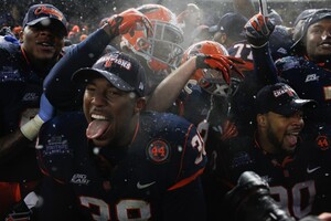 Syracuse linebacker Cameron Lynch celebrates the Orange's 38-14 victory over West Virginia in the Pinstripe Bowl. Lynch started in place of Marquis Spruill and finished with six tackles and a sack. 