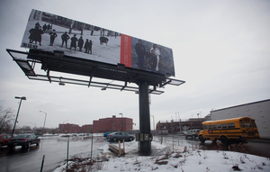 The Iconic Syracuse billboard on West Fayette and West streets features three local children who are active participants in SU’s Photography and Literacy Project. The goal of the project is to teach inner city students to express themselves through digital media.