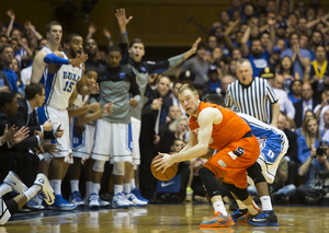 Trevor Cooney is pressured in Syracuse's 66-60 loss to Duke on Saturday. Cooney and backcourt mate Tyler Ennis both struggled in the contest. 