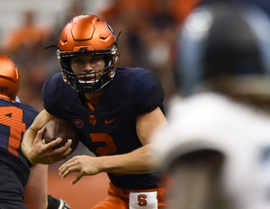 Freshman quarterback Eric Dungey runs against Rhode Island.