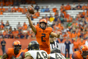 Syracuse quarterback Eric Dungey leaps for a high snap in the first half of Syracuse's win over Wake Forest on Saturday. 