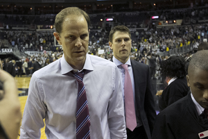 Mike Hopkins began his temporary stint as Syracuse's head on Saturday against Georgetown, and will be head coach for the next eight games.