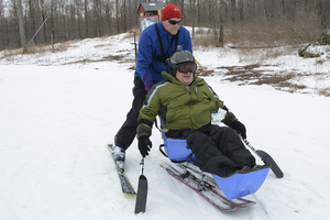 Although he is in a wheelchair, Gregg Kuersteiner is still able to go skiing with his family on the weekends.