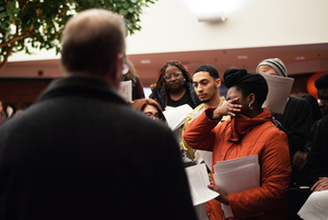 Tayla Myree, an organizer of the Recognize Us movement, wipes away tears as Chancellor Kent Syverud addresses protesters on Friday. 