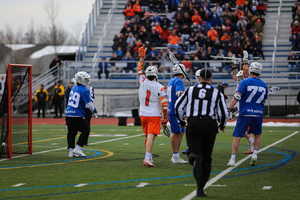 Bradley Voigt sticks his hand in the air after a Syracuse goal.