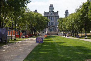 Colleges and universities in New York state that report 100 positive tests within a two-week period must transition all classes to an online format for at least 14 days.