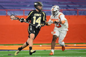 Syracuse Orange midfielder Dami Oladunmoye defends Army player during season-opener loss.