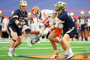 Danny Varello fights for a faceoff, a battle the Orange lost 23-9 on Saturday afternoon.