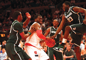 Rick Jackson splits defenders in SU's win over Michigan State Tuesday.