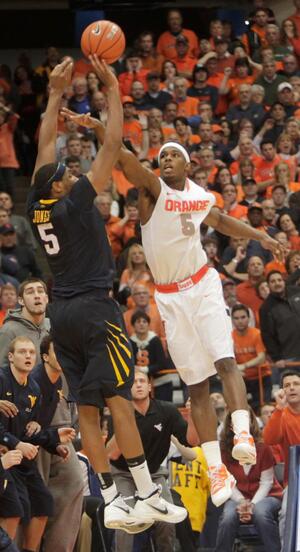 C.J. Fair defends Kevin Jones as Jones attempts a game-tying 3 in the final seconds. His shot clanked off the rim and Syracuse held on for a two-point win.