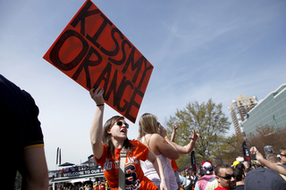 Evelyn Burgess, a freshman at Syracuse University, taunts Michigan fans in Centennial Park.