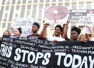 During a Black Lives Matter march in Syracuse, protesters sing: 