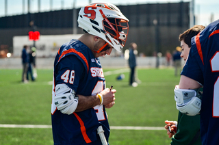 Salcido signs an autograph after the game. 