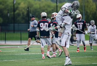 Colgate celebrates one of its nine goals on SU. 