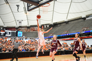 Tiana Mangakahia shoots a layup at the rim. She scored 21 points in SU's win.