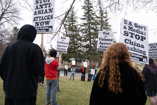 Kaitlin Maroney speaks to demonstrators at the rally against anti-Asian violence in Thornden Park.