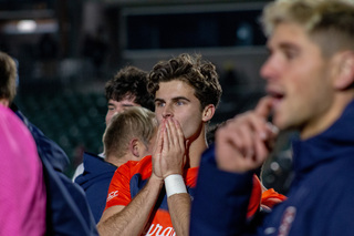 Emotions ran high as fans and media flooded the field to congratulate the Orange. Junior midfielder Jackson Glenn stood in disbelief as people moved all around him yelling, hugging and cheering. 