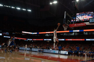 Freshman Judah Mintz breaks away from the Duke defense and runs down the court to dunk the ball. Mintz scored 18 points in the game against the Blue Devils. 